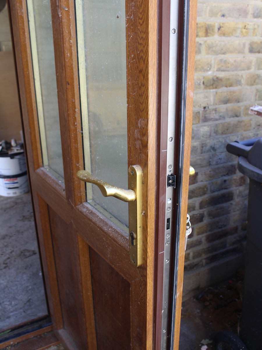 composit brown backdoor with glass panels and new euro cyilnder